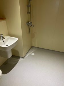 A bathroom with a sink and shower