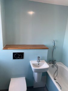 A bathroom with a sink, toilet and bathtub