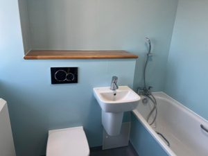A bathroom with a sink, toilet and bathtub