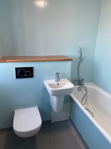 A bathroom with a sink, toilet and bathtub