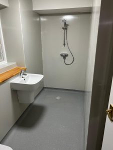 A bathroom with a shower and sink