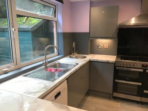 A kitchen with a sink and a window