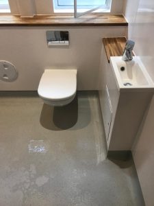 A toilet and sink in a bathroom