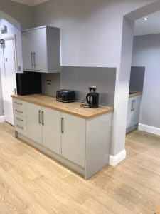 A kitchen with cabinets and appliances
