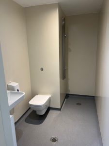 A bathroom with a toilet and sink
