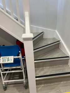 A wheelchair next to stairs